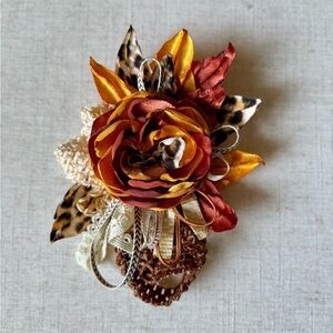 Women’s fall flower pin.